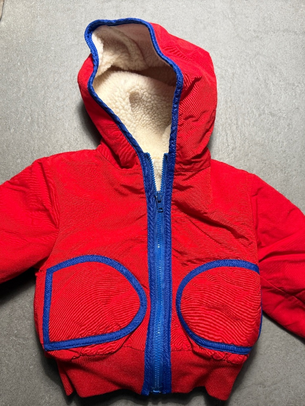 Red fleece lined jacket with blue trim